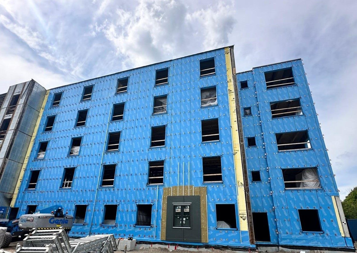 TAC 2.1 thermal assembly clips installed across a multi-storey rainscreen façade with BlueSkin air/vapour barrier
