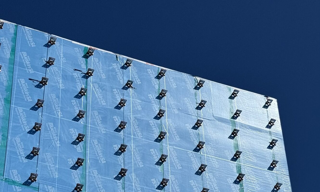 Grid array of TAC 2.1 thermal assembly clips installed on a building envelope before cladding installation